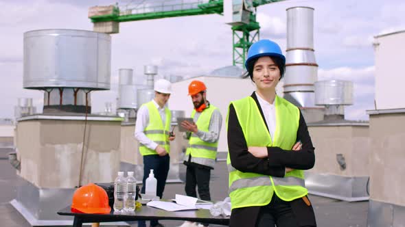 Attractive Young Woman Assistant of Engineer on