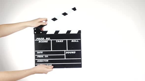 Hands Use Movie Clapper Board, on White, Slow Motion