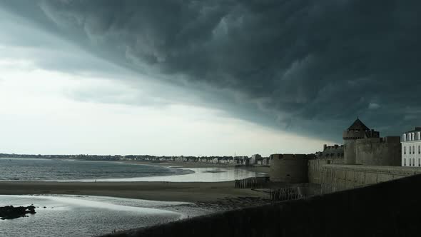 Black cloud over the ocean coast