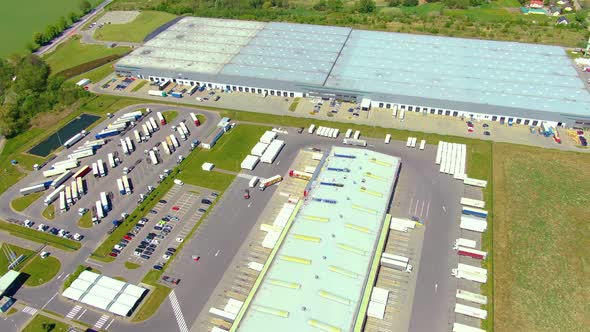 Aerial view of warehouse storages or industrial factory or logistics center from above. Top view of