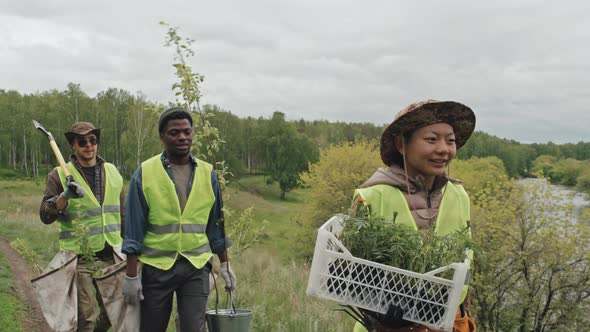 Farmers Carrying Seedlings