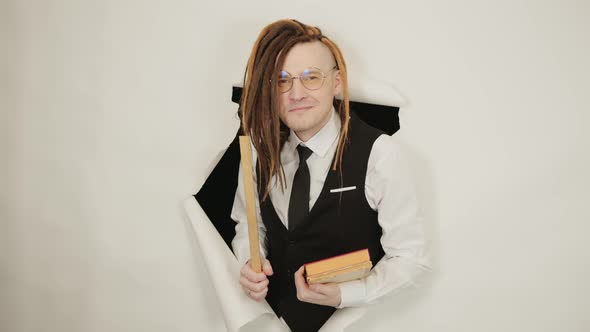 Young Teacher in Glasses with Ruler and Books in Hole of White Background