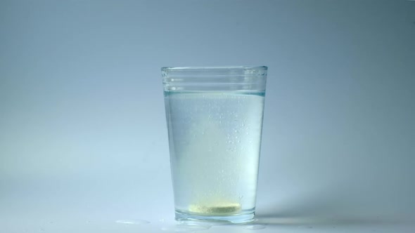 Medicine Melting In A Glass Of Water	