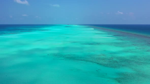 Aerial top down abstract of luxury resort beach vacation by blue water with clean sand background of