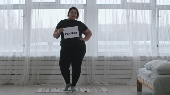 Concept Body Positivity  a Chubby Woman Holds a Sign with the Inscription PERFECT