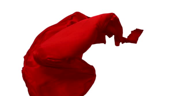 Red fabric flowing on white background, Slow Motion