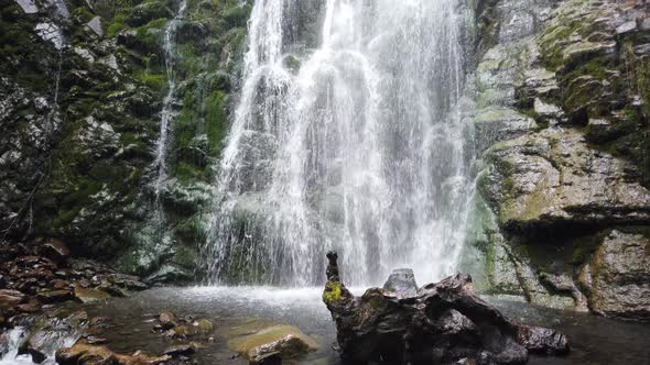 Amazing waterfall among lush greenery in fair weather