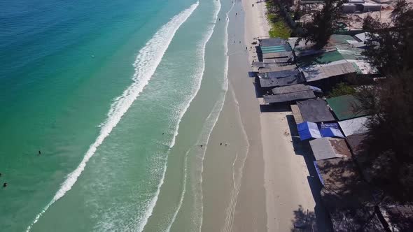 Drone Footage of Sea Coastline with Entertainment Area.