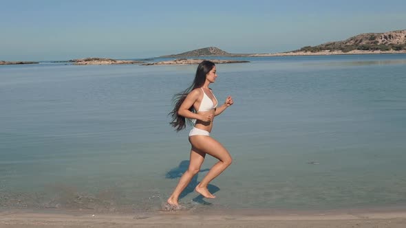 Young Asian Women Exercising with Outdoor Running Mountain Sea Background