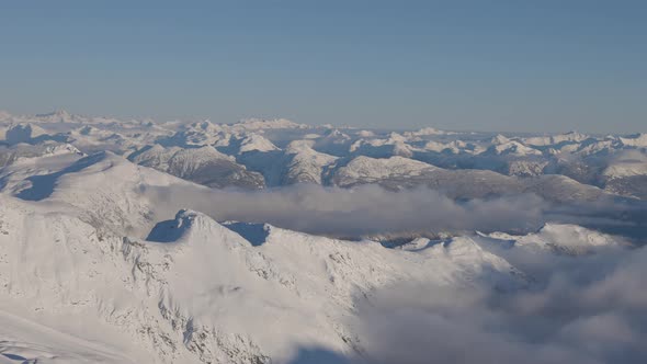 Aerial Panoramic View of Canadian Mountain Covered in Snow