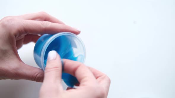 Girl Stretching Blue Slime to the Sides