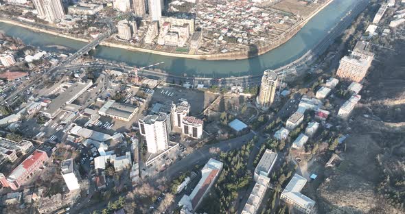 Aerial view of Ortachala district at sunset. cityscape over Kura river in Tbilisi, Georgia 2022