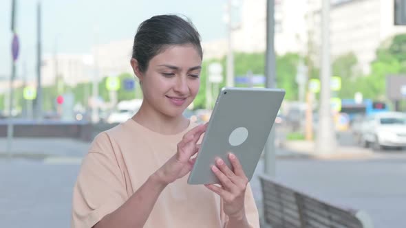 Portrait of Indian Woman Using Digital Tablet