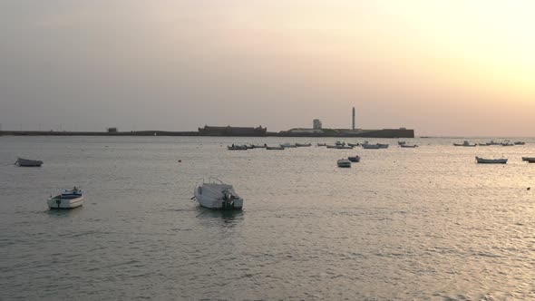 Anchored boats at sunset