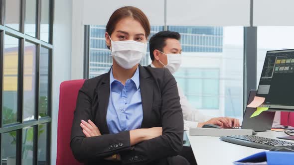 Portrait of young office business woman wear mask, working indoor with new normal lifestyle.