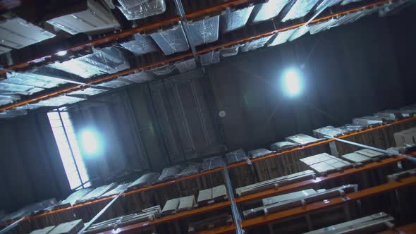 Shelves with Goods in Cardboard Boxes and Packages Full of in Retail Warehouse