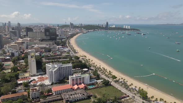 Pattaya beach Coastline, Beachfront cityscape summer destination, Aerial pullback