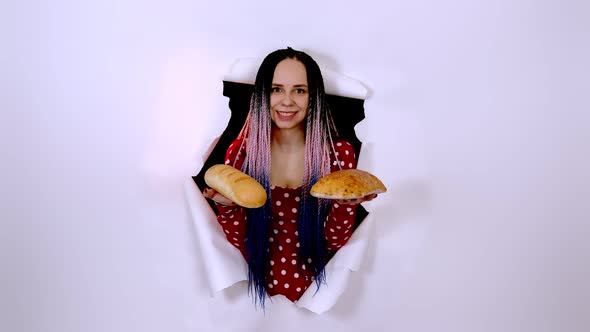 Young Woman Holding White Bread