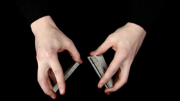 Playing Cards Being Shuffle, on a Black Surface By Magician