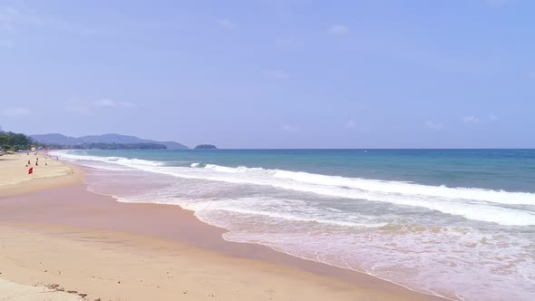 beautiful waves Foaming and Splashing on the beach sand. Ocean sea