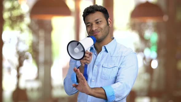 Young Brownskinned Foreman Speaking in Megaphone