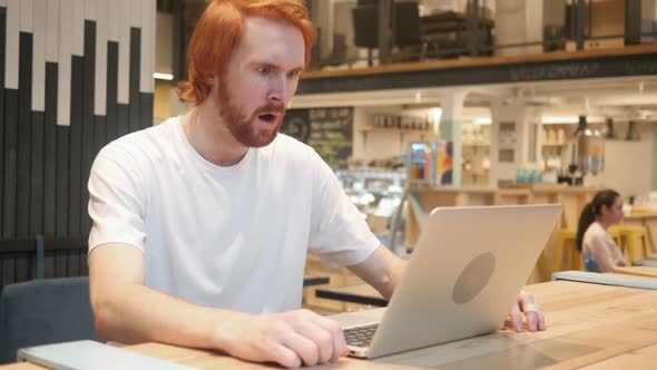 Astonished Amazed Redhead Beard Man Working in Cafe