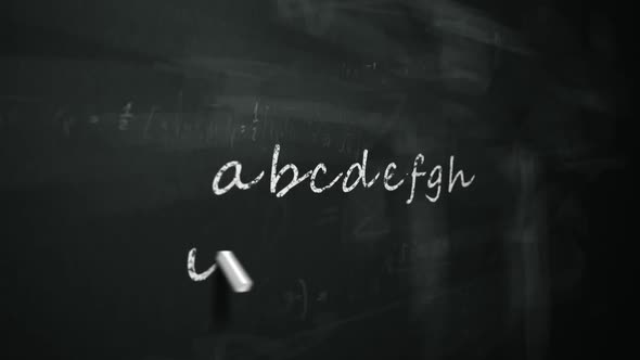 Writing a standard set of letters forming Latin alphabet by white chalk.