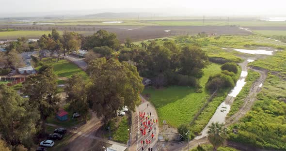 Aerial View of people running during the city marathon, Northern District.