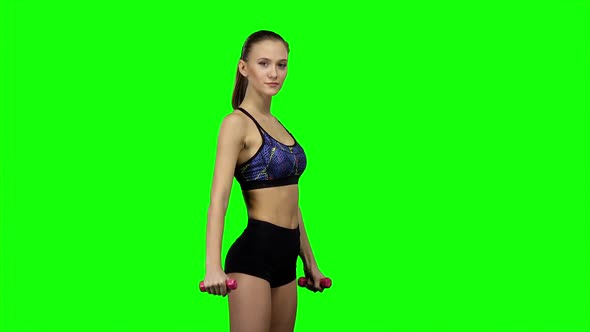 Woman Fitness Instructor Doing Exercises. Green Screen