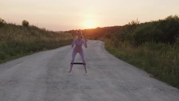 Slow Motion of a Girl That Jumps with Elastic Band