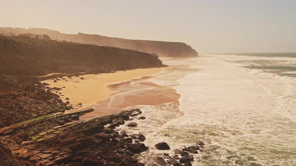 Aerial Drone View of Praia Grande Sandy Beach with Cliffs, showing Coastal Scenery and Coastline at