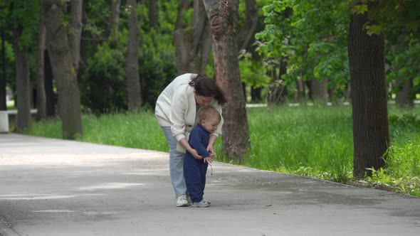 Mother and Child Walking in the Park in Summer Happy 1