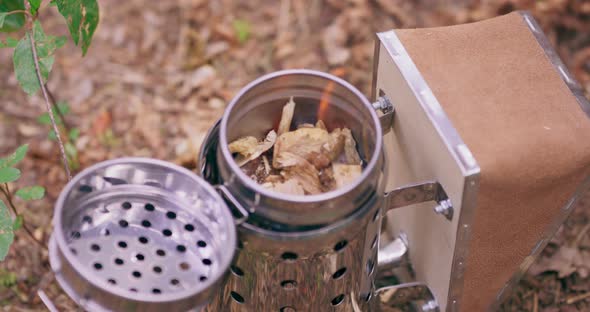 Closeup Focused Shining New Metal Smoker on the Ground in the Middle of the Forest and Beekeeper's