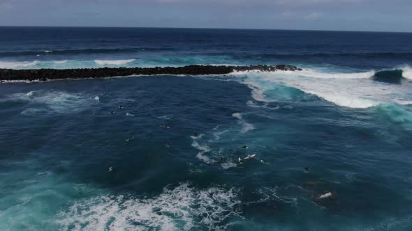 Surfers waiting for a wave (Puerto de la Cruz, Tenerife, Canary Islands, Spain)