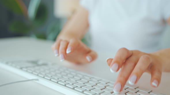 Female Hands Typing on a Computer Keyboard