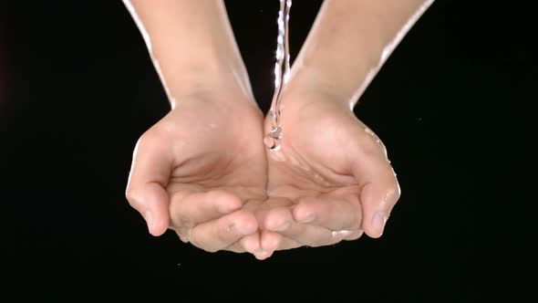 Water pours into hands, Slow Motion