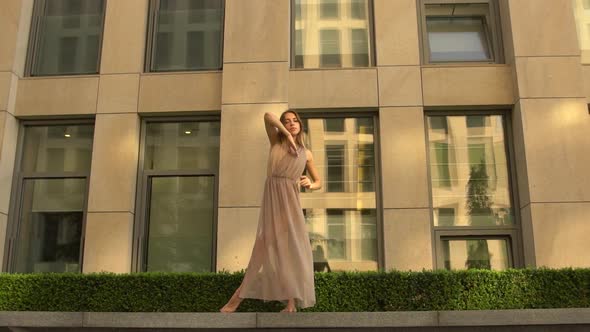 Beautiful Young Girl Dancing Performing Contemporary on the Street of a Modern City. Slow Motion.