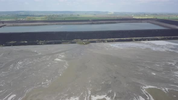 Aerial Video of an Ash Dump. The Pipeline From Which the Products of Coal Combustion Are Discharged