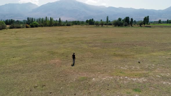 Man Walking In Countryside