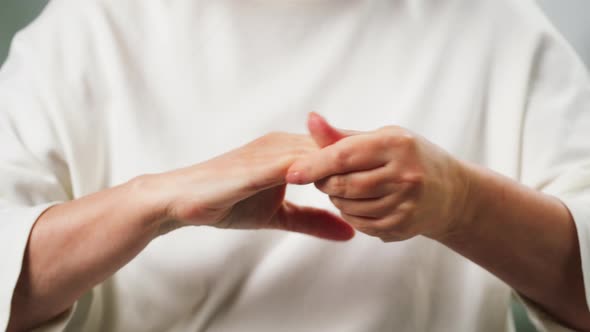 Old Woman Doing Hand Massage Closeup