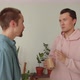 Standing in the Center of the Living Room One of Lgbt Men is Talking to His Boyfriend About the - VideoHive Item for Sale