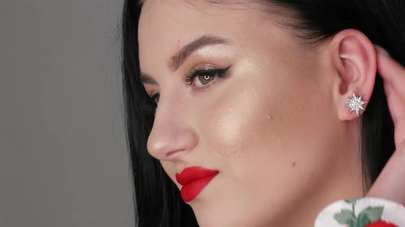 Close Up View of Beautiful Girl Model with Big Lips Painted with Red Lipstick