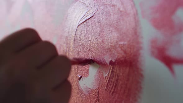 Closeup of Unrecognizable Artist Paints Red Peonies or Other Flowers with Brush on the Canvas