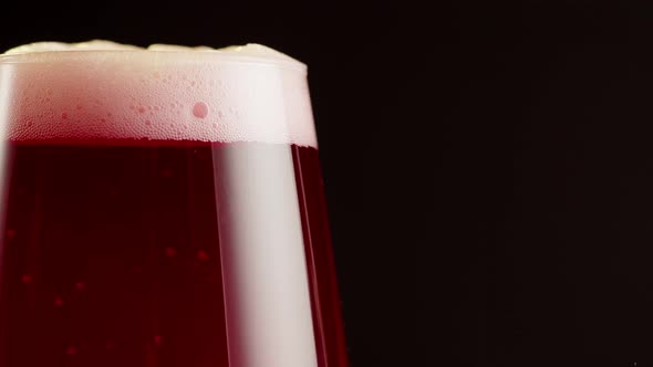 Foamy Cherry Beer in Glass Closeup Belgian Lambic