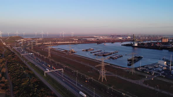 Seaport Of Maasvlakte With Windmills On The Background In The Netherlands. aerial