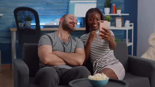 Modern Interracial Couple Talking on Video Call Conference