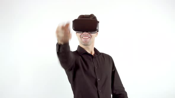Man Playing in Virtual Reality Goggles