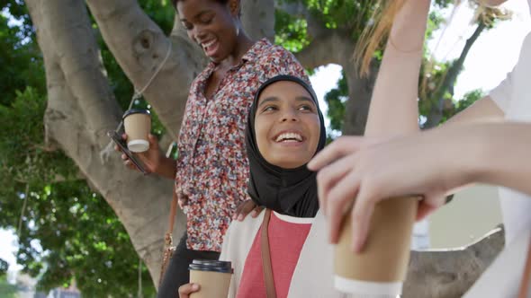 Young adult female friends hanging out together