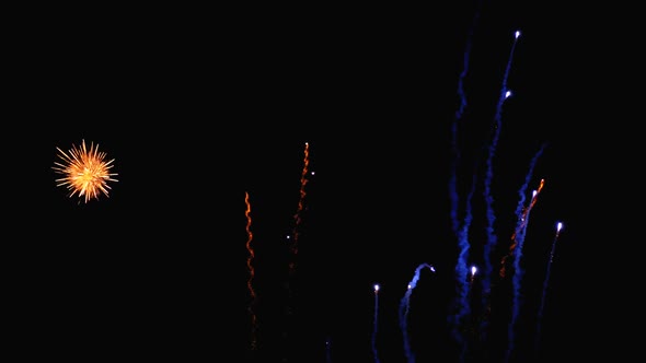 Fireworks Flashing in the Night Sky. Slow Motion. Real Fireworks with Smoke