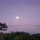 Timelapse Full moon reflecting bright light Above the sea of fog at dawn The time before sunrise - VideoHive Item for Sale